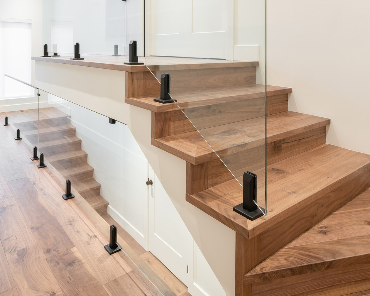 https://craftfloor.com/wp-content/uploads/2026/03/Segovia-Walnut-residence-louis-hemon-Stairs.jpg